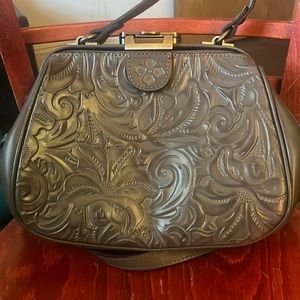 Patricia Nash grey purse. Leather outside suede inside gentle use.